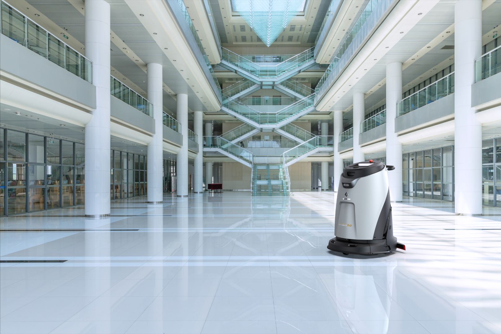 Robotic floor cleaning machine in a school hallway environment