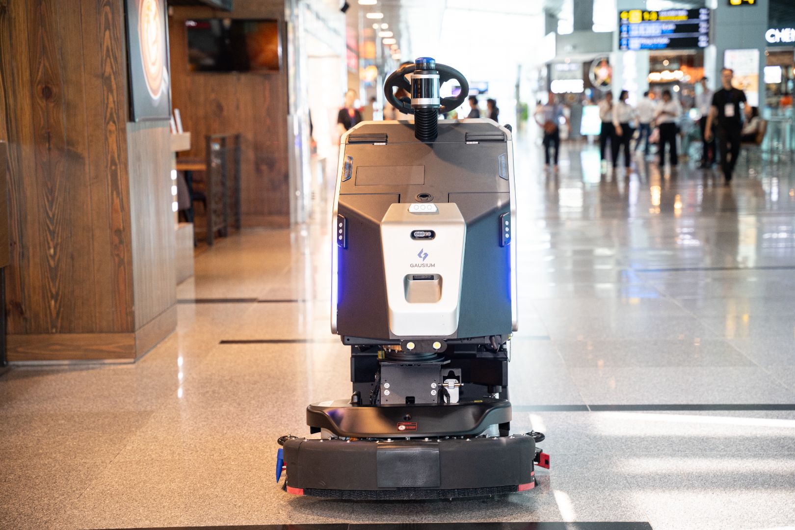 Autonomous robotic floor cleaner working in an airport terminal